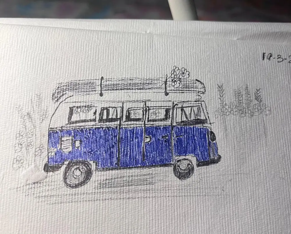 A camper van drawn in pencil on lined paper and coloured deep blue